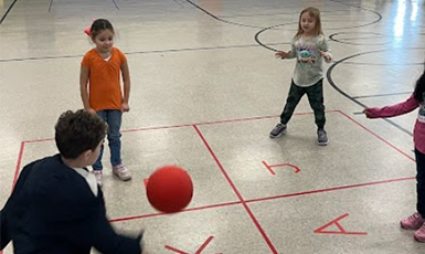  children playing four square game